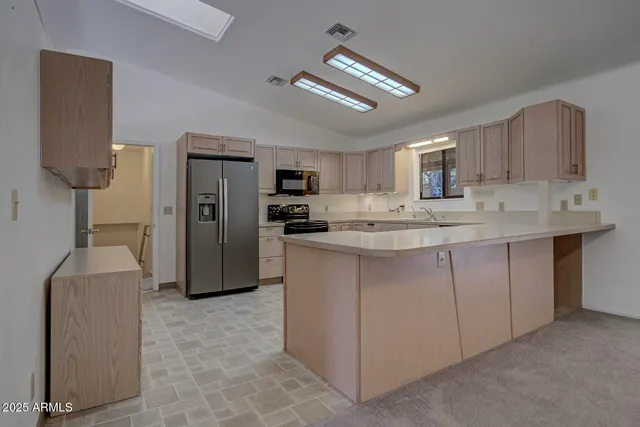 a bathroom with a shower sink vanity mirror and toilet