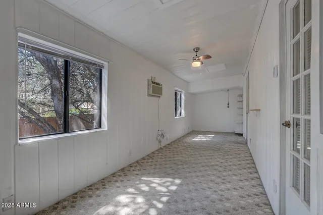 an aerial view of a house with a yard and garden