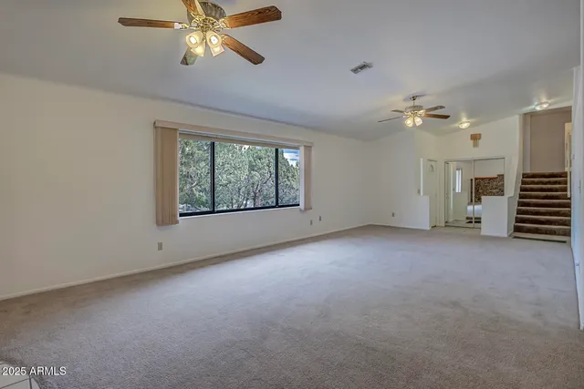 a kitchen with stainless steel appliances granite countertop a refrigerator a sink a stove a microwave a counter top oven and cabinets