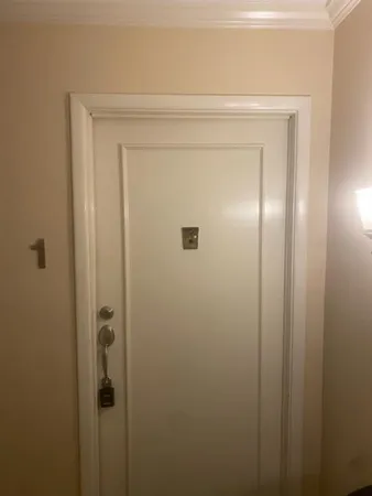 a bathroom with a glass door shower