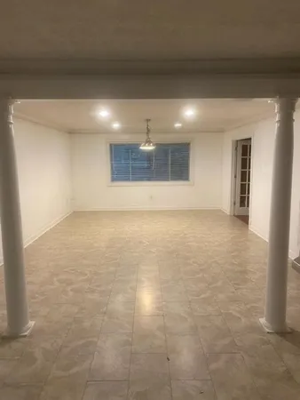 a view of a kitchen with a sink and a refrigerator