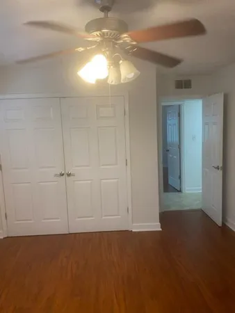an empty room with a empty space and windows