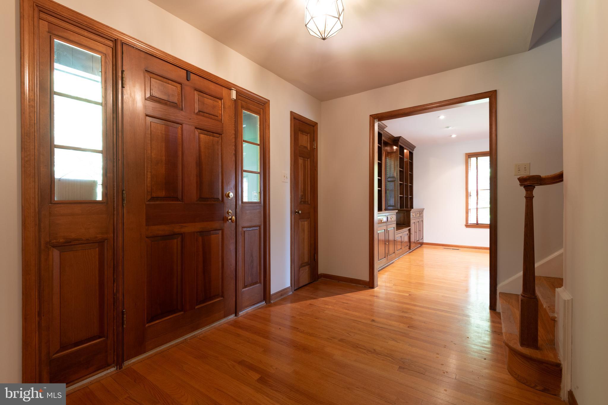 16120 Barnesville Road Boyds, MD 20841 - Photo 11 of 128 a view of a hallway with wooden floor and staircase