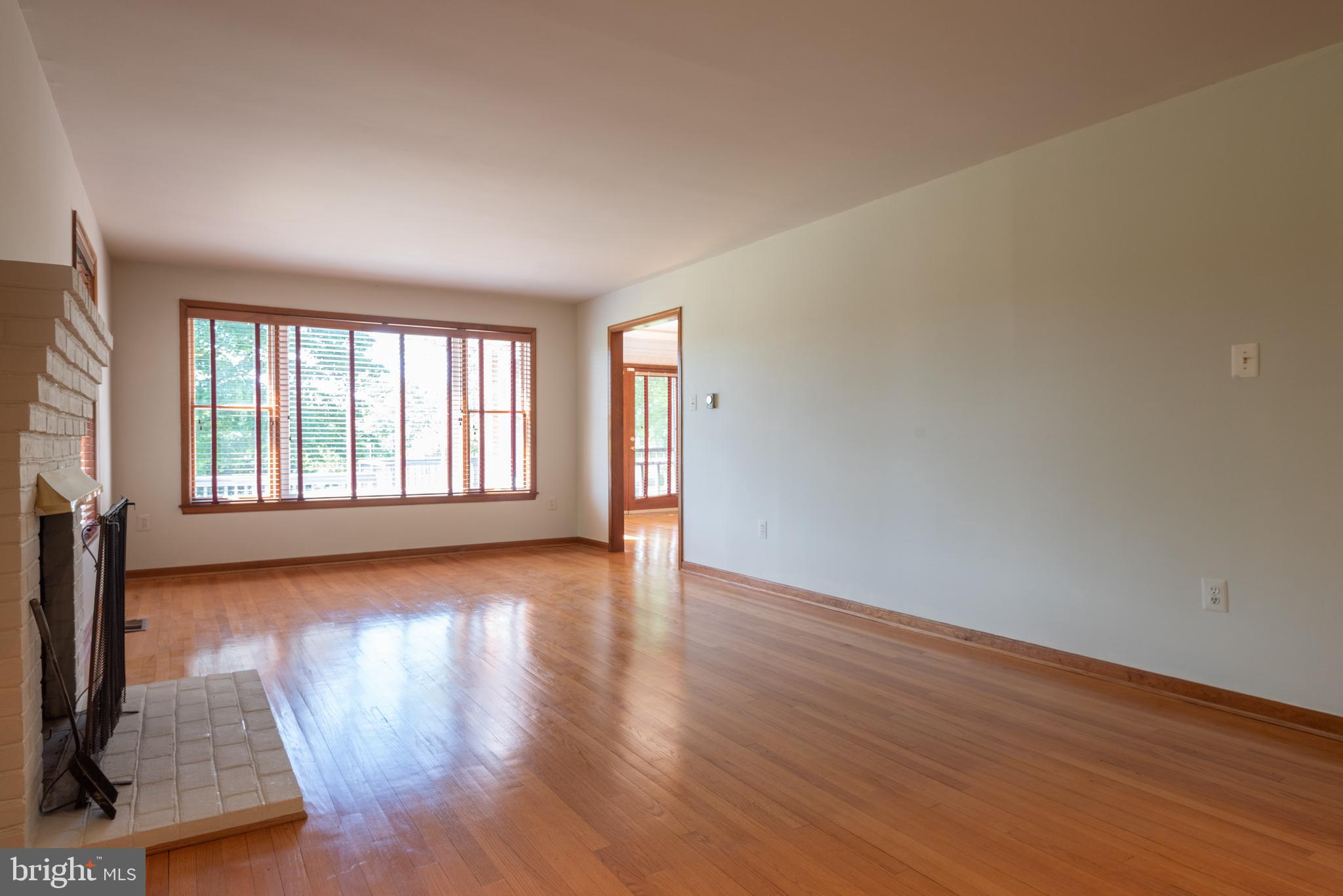 16120 Barnesville Road Boyds, MD 20841 - Photo 17 of 128 a view of an empty room with wooden floor and a window
