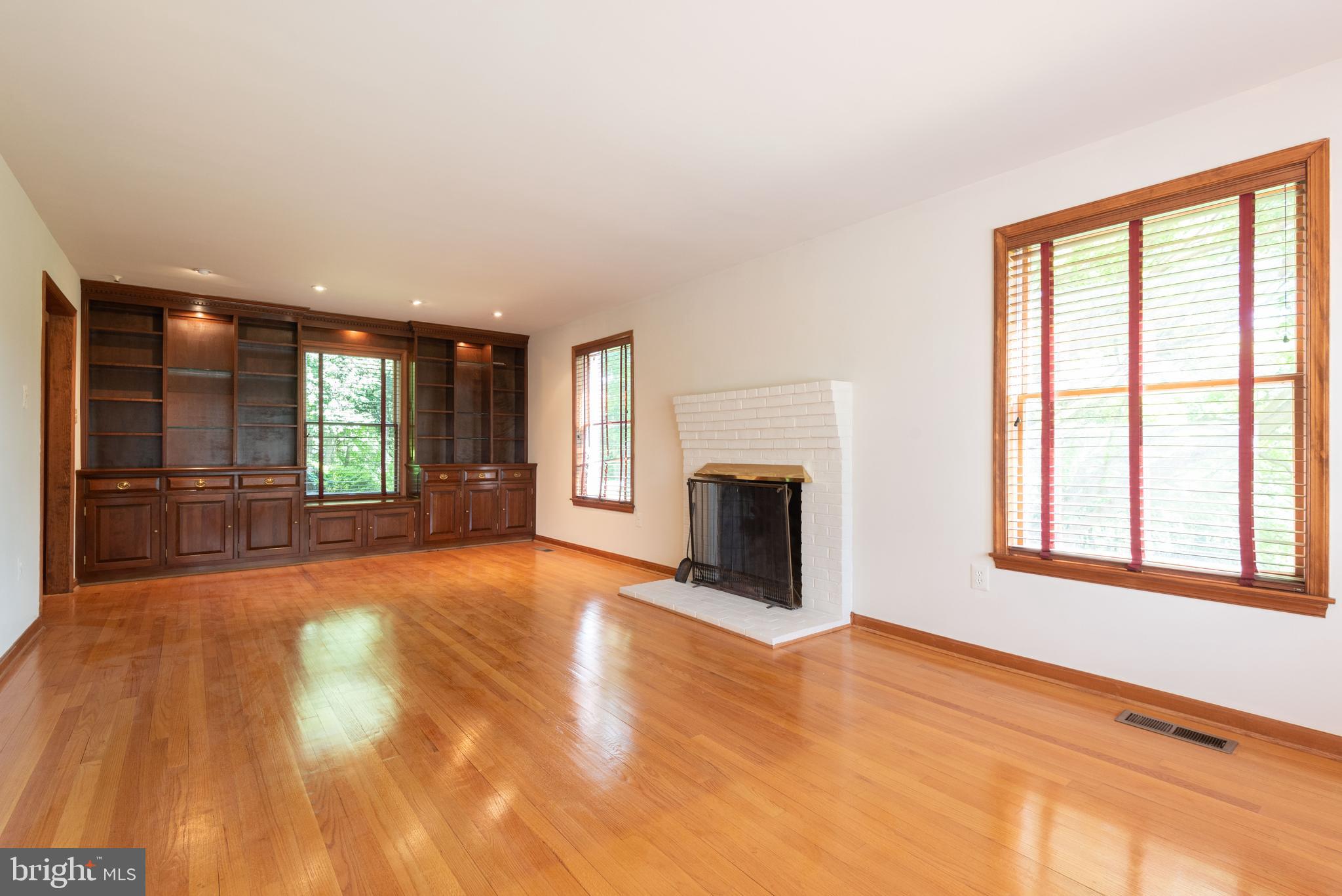 16120 Barnesville Road Boyds, MD 20841 - Photo 19 of 128 a view of an empty room with a fireplace and a window