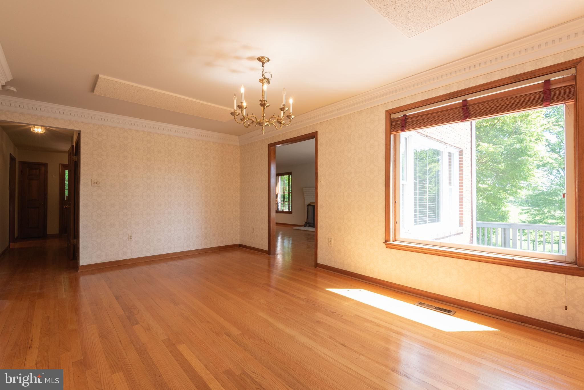 16120 Barnesville Road Boyds, MD 20841 - Photo 26 of 128 a view of an empty room with wooden floor and a window