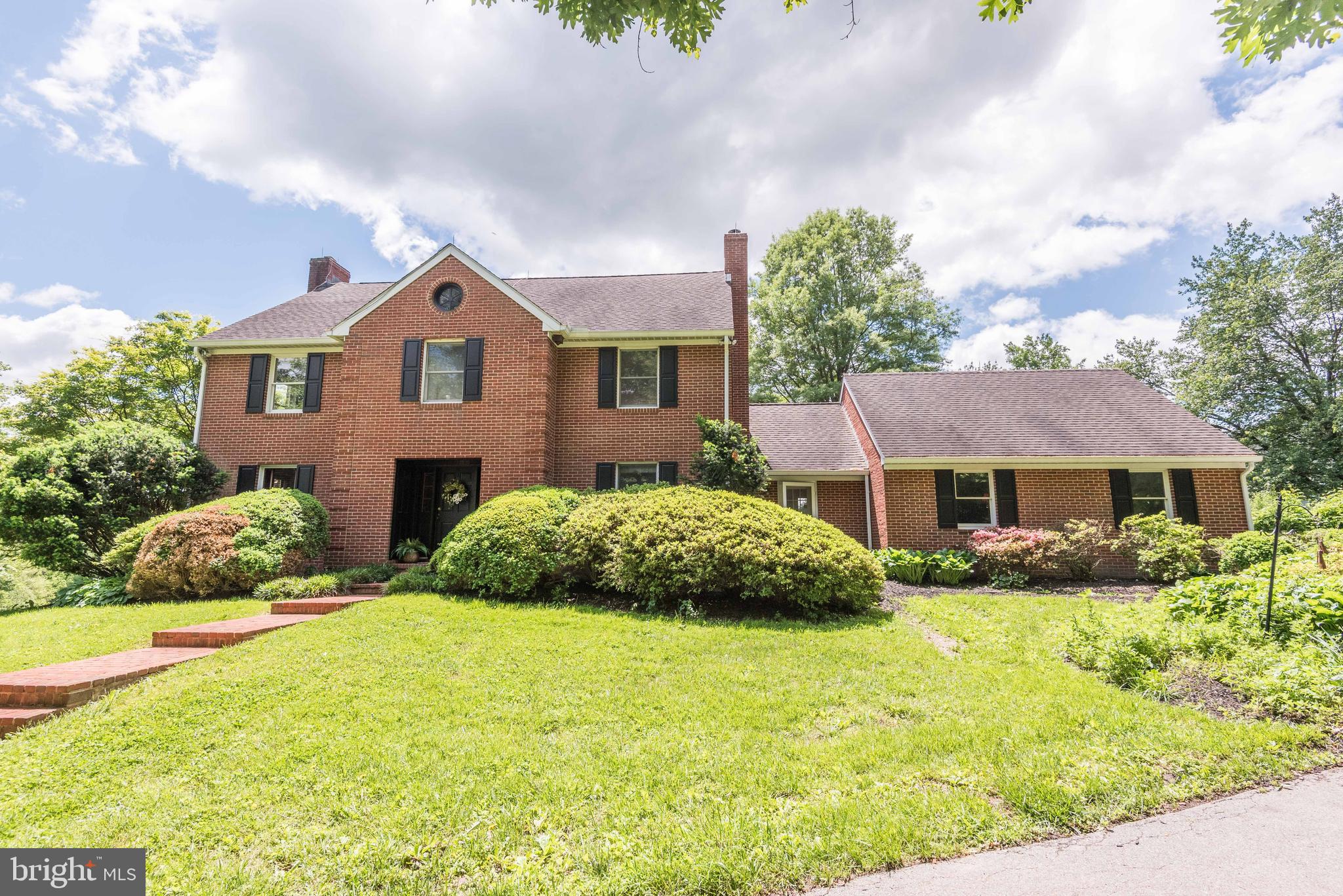 16120 Barnesville Road Boyds, MD 20841 - Photo 3 of 128 a front view of a house with a yard and garage