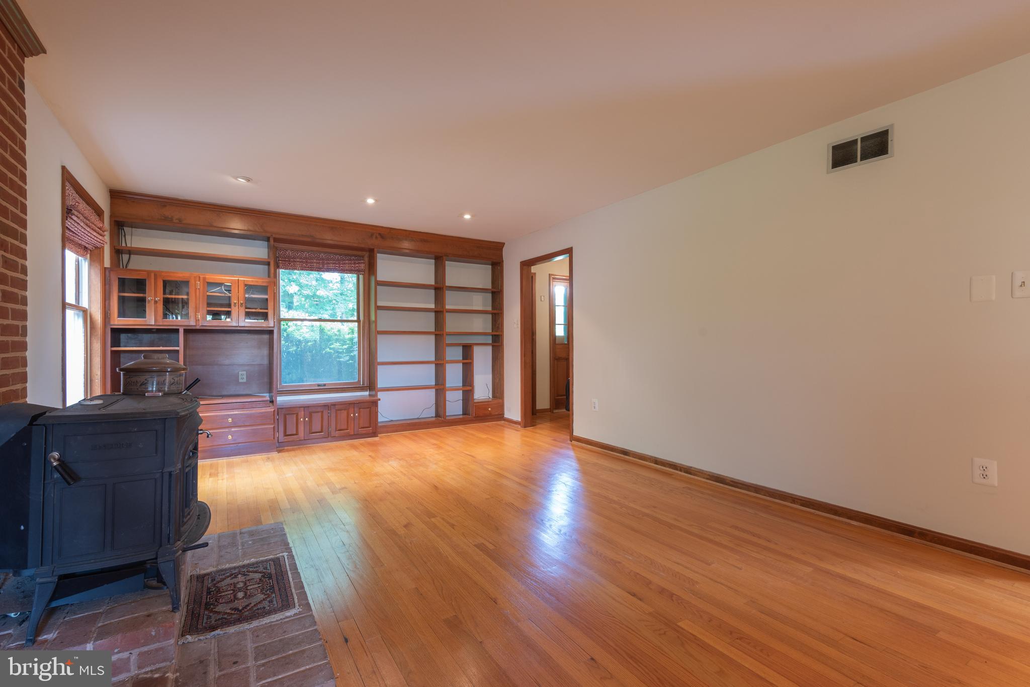 16120 Barnesville Road Boyds, MD 20841 - Photo 32 of 128 a view of an empty room with wooden floor and a window