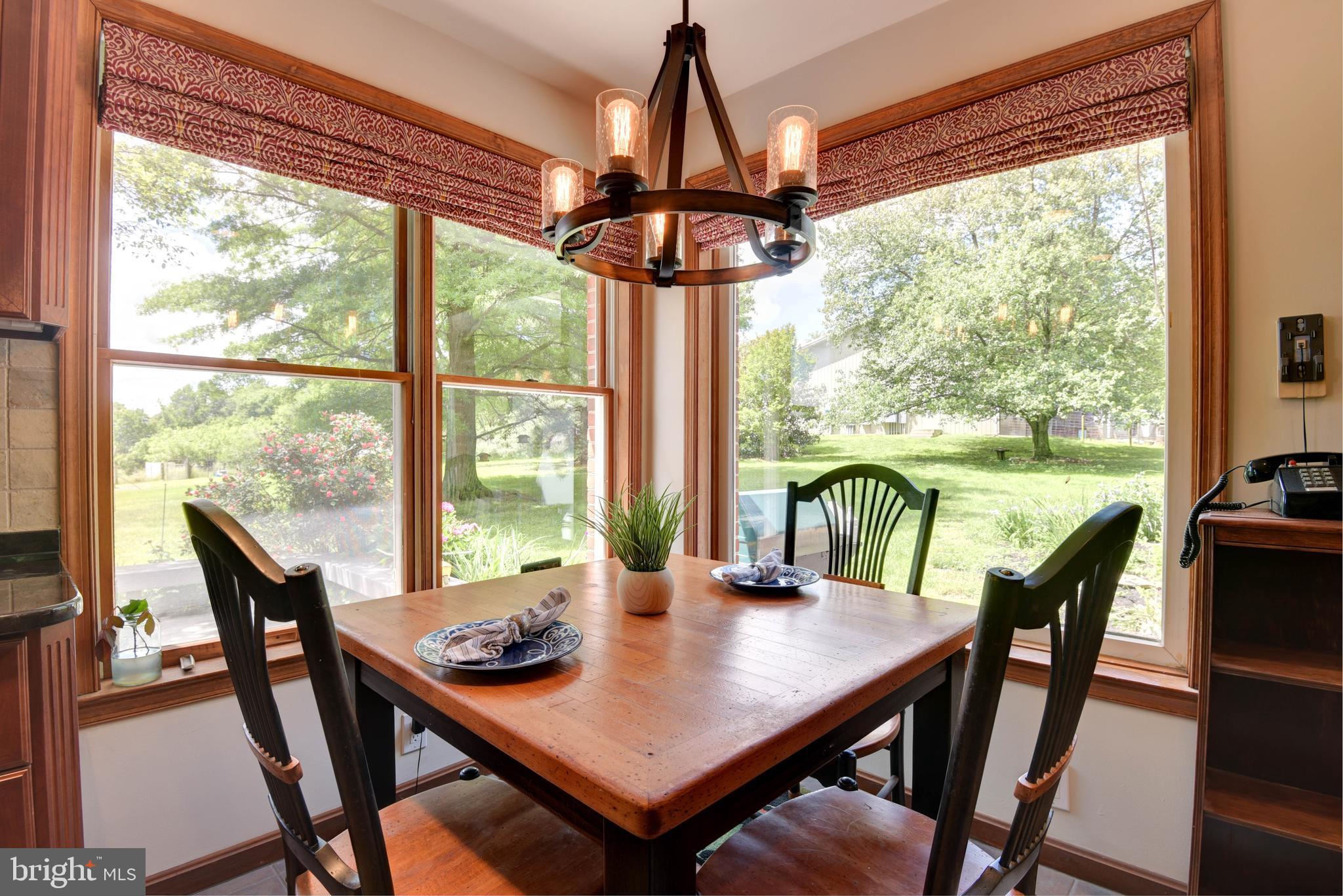 16120 Barnesville Road Boyds, MD 20841 - Photo 40 of 128 a view of a dining room with furniture window and outside view