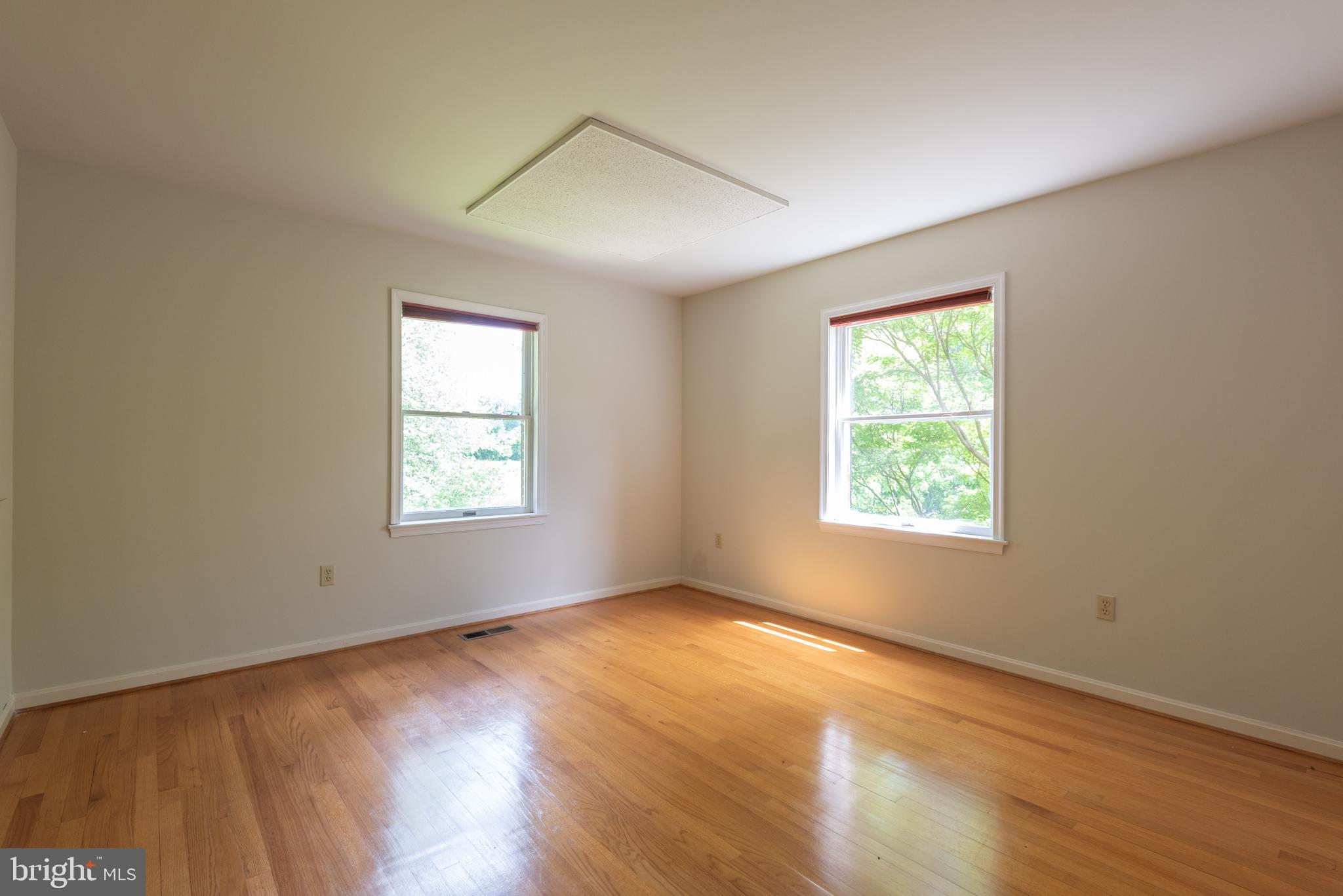 16120 Barnesville Road Boyds, MD 20841 - Photo 42 of 128 an empty room with wooden floor and windows