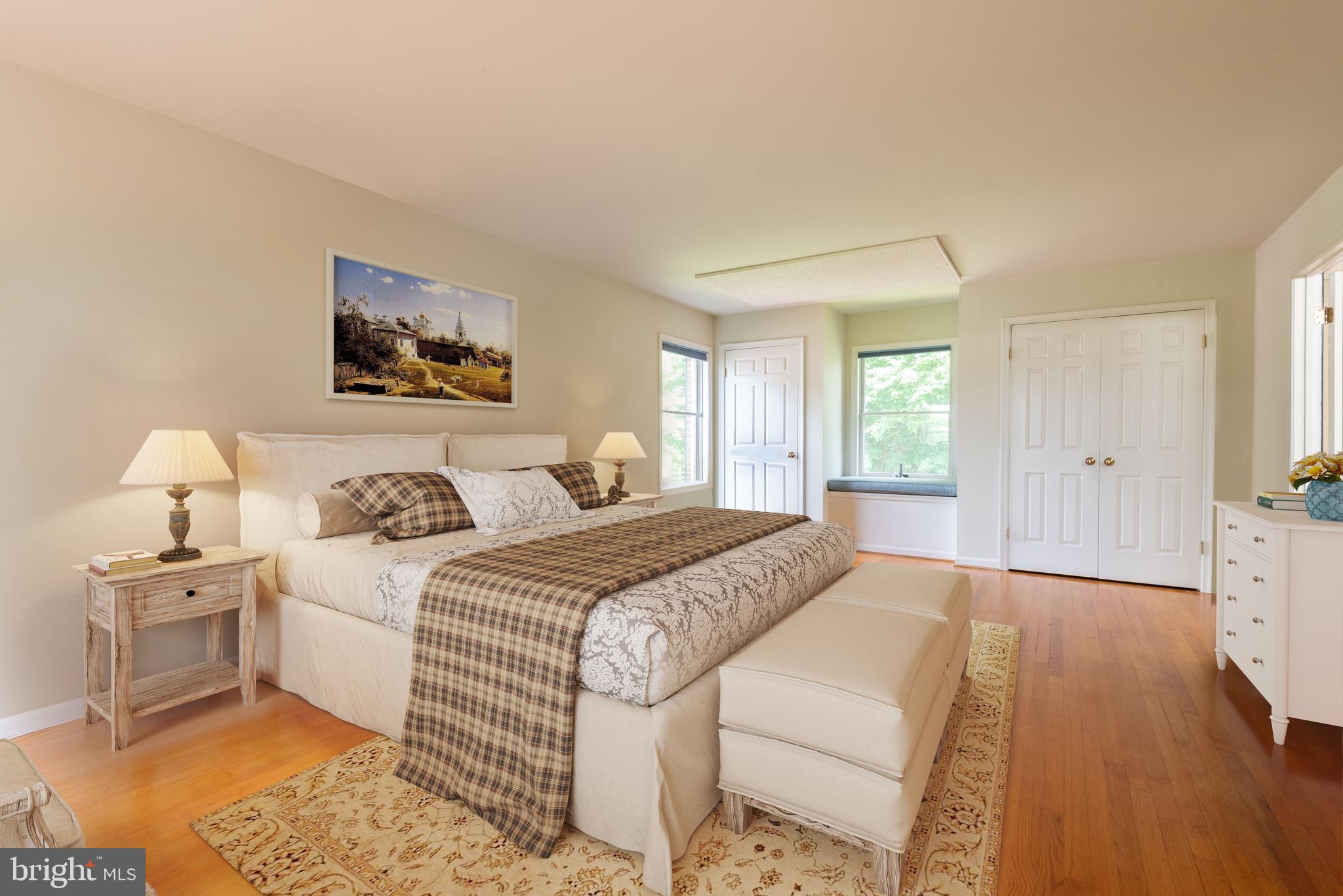 16120 Barnesville Road Boyds, MD 20841 - Photo 48 of 128 a spacious bedroom with a bed and a couch