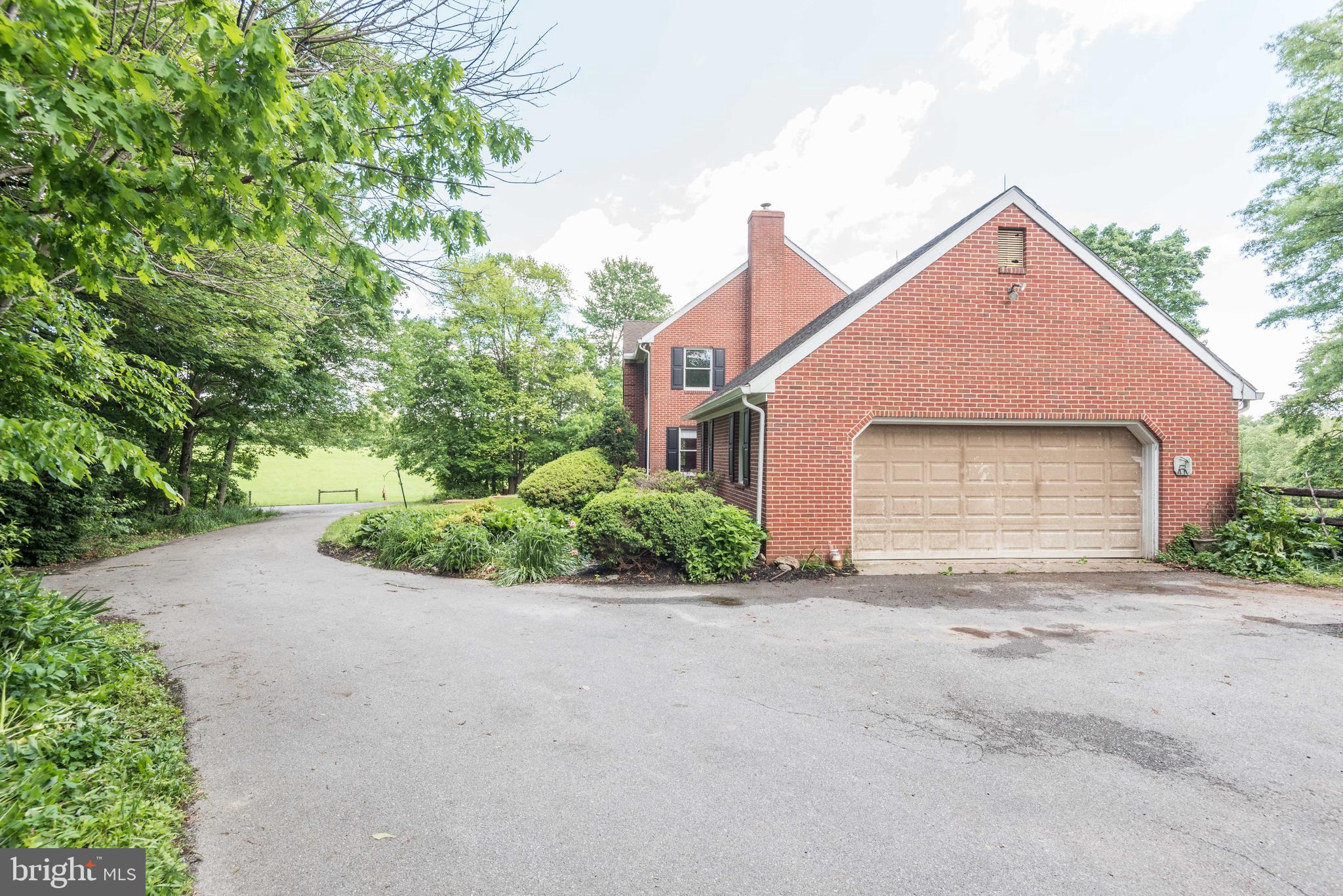 16120 Barnesville Road Boyds, MD 20841 - Photo 6 of 128 a front view of a house with a yard and garage