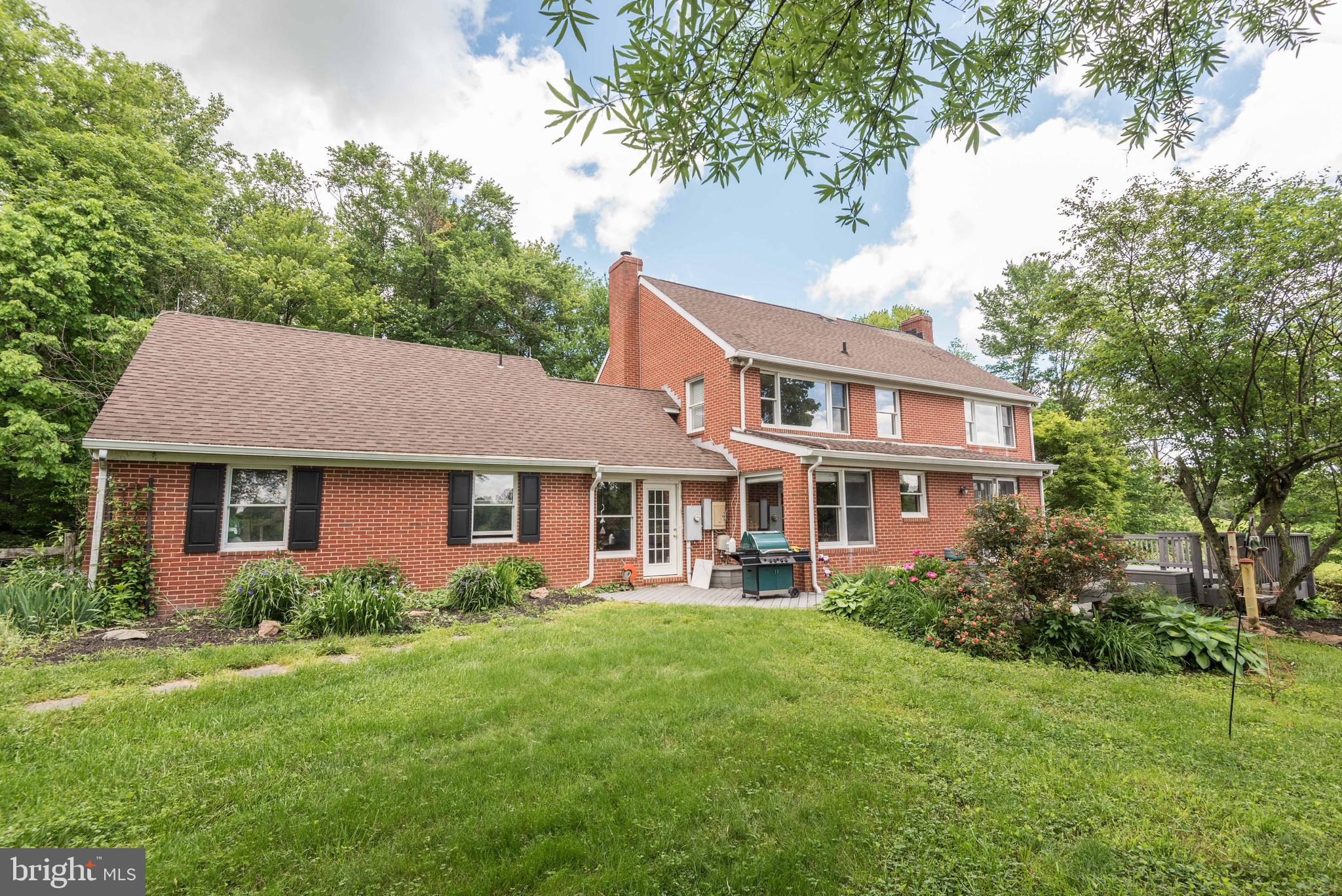 16120 Barnesville Road Boyds, MD 20841 - Photo 8 of 128 a front view of a house with a yard and trees