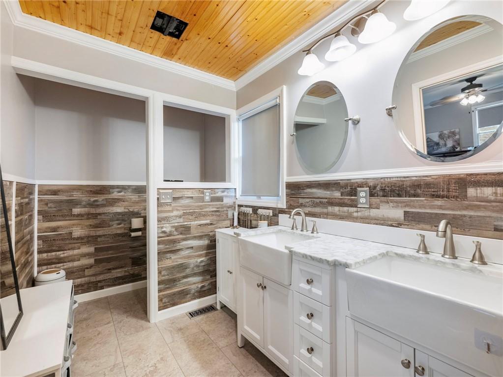 849 Blacksnake Road Mount Airy, GA 30563 - Photo 18 of 68 a bathroom with a double vanity sink mirror and