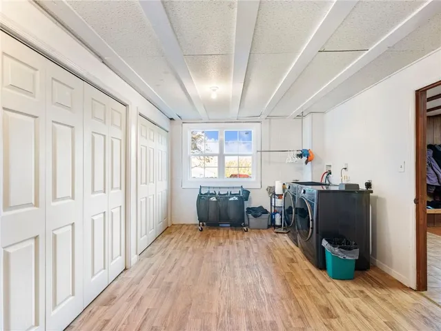 a view of a yard with large trees