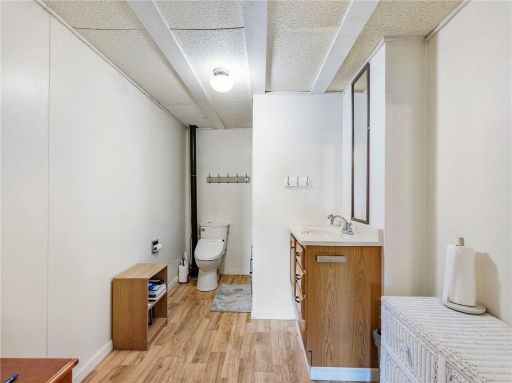 849 Blacksnake Road Mount Airy, GA 30563 - Photo 28 of 68 a view of a hallway with bathroom and wooden floor