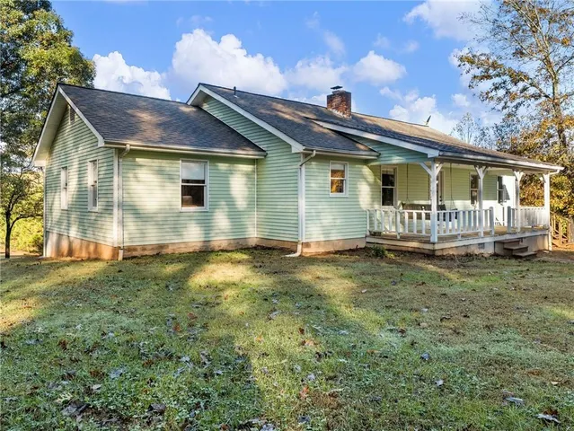 a view of residential houses with swimming pool