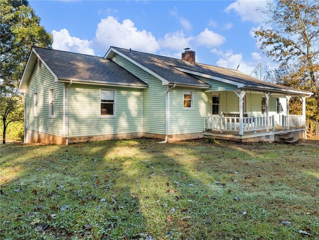 849 Blacksnake Road Mount Airy, GA 30563 - Photo 31 of 68 a front view of a house with garden