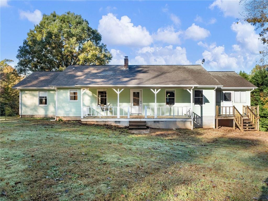 849 Blacksnake Road Mount Airy, GA 30563 - Photo 5 of 68 a front view of a house with a garden