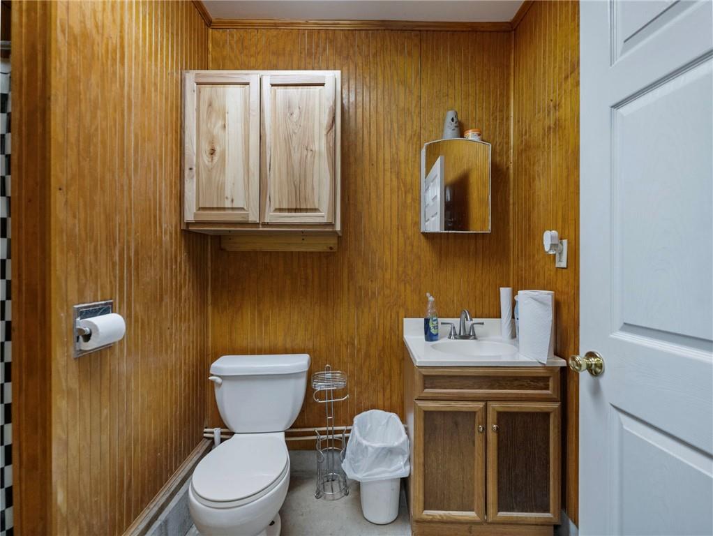 849 Blacksnake Road Mount Airy, GA 30563 - Photo 61 of 68 a bathroom with a toilet sink washing machine and mirror