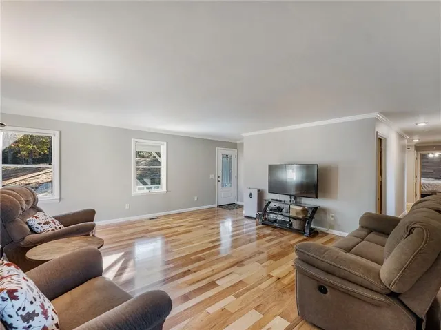 a kitchen with a sink a stove top oven a refrigerator and cabinets