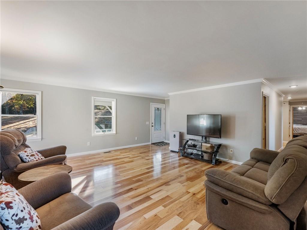 849 Blacksnake Road Mount Airy, GA 30563 - Photo 7 of 68 a living room with furniture and a flat screen tv