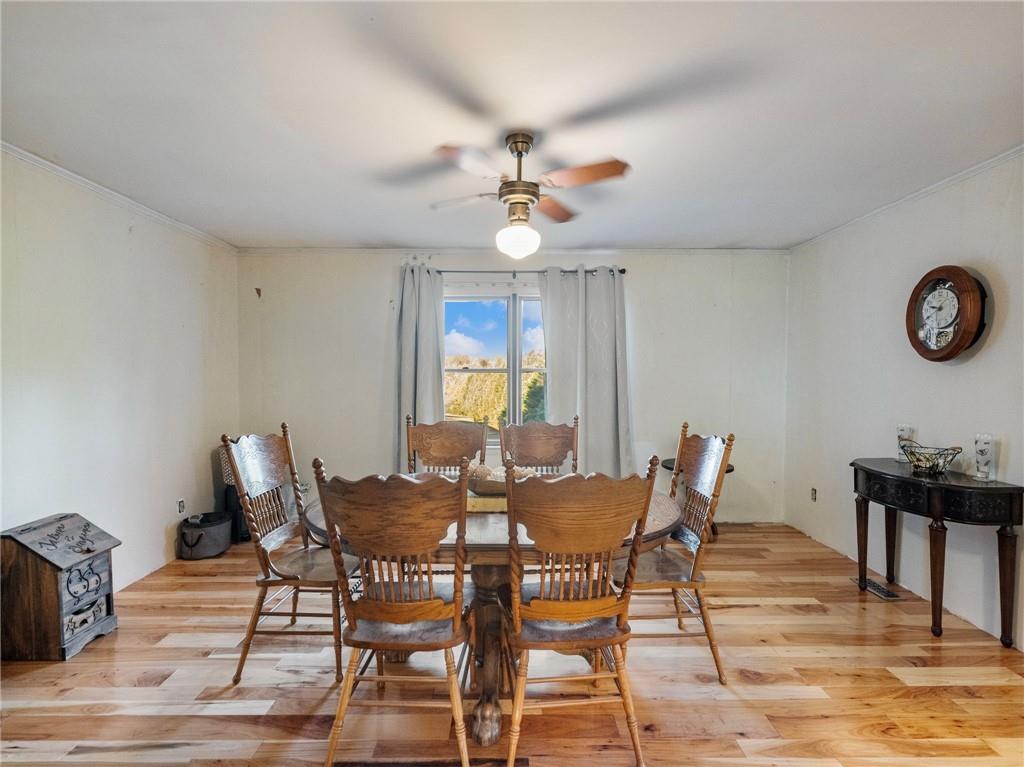 849 Blacksnake Road Mount Airy, GA 30563 - Photo 8 of 68 a view of a dining room with furniture and a chandelier fan