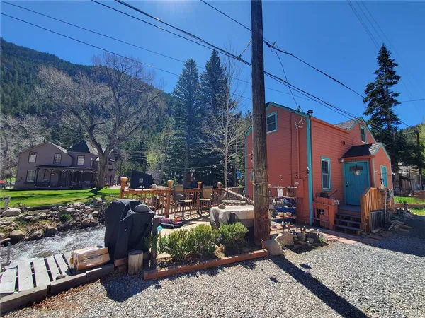 a view of a backyard with sitting area