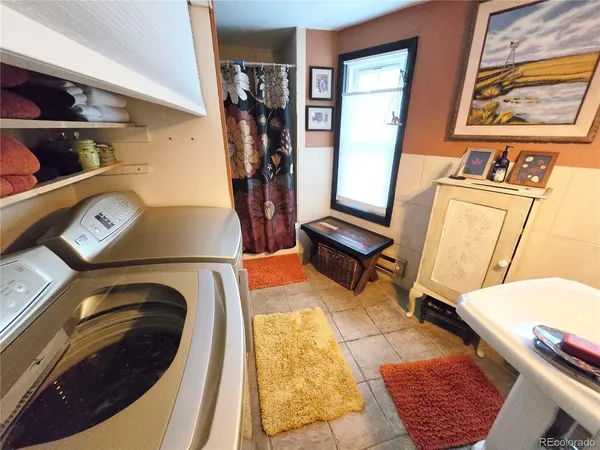 a view of living room with furniture and a rug