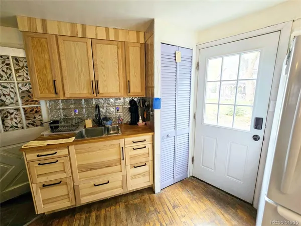 a view of a kitchen with dishwasher a stove and a window