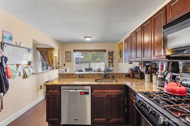 a kitchen with a stove and a sink