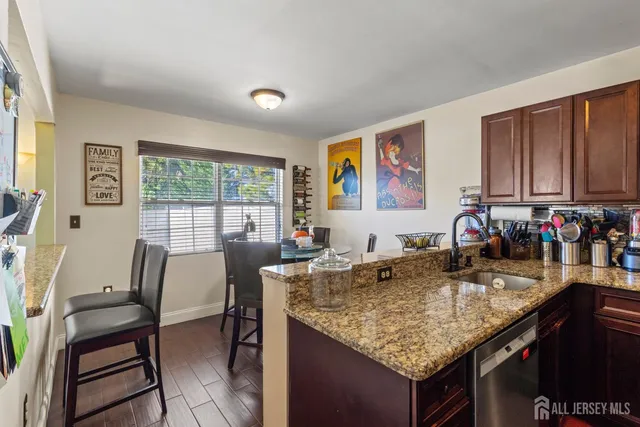 a kitchen with a stove a sink and a refrigerator