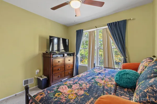 a bedroom with a bed and furniture