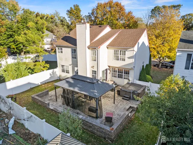 aerial view of a house with swimming pool and sitting area