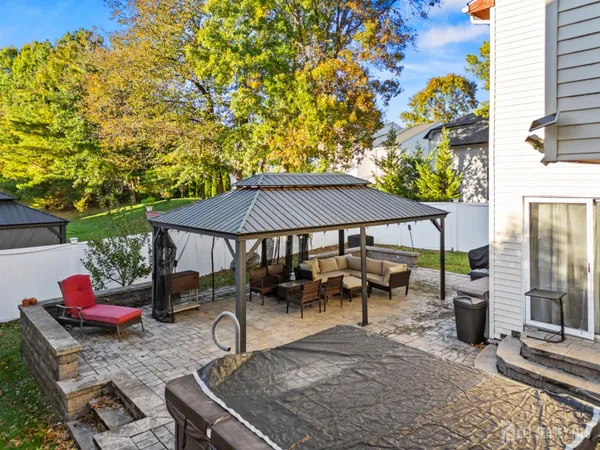 a backyard of a house with table and chairs