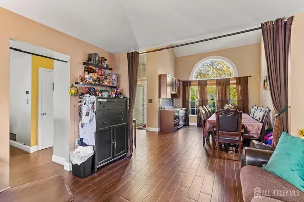 a view of a livingroom with furniture a livingroom and wooden floor