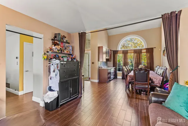 a view of a livingroom with furniture a livingroom and wooden floor