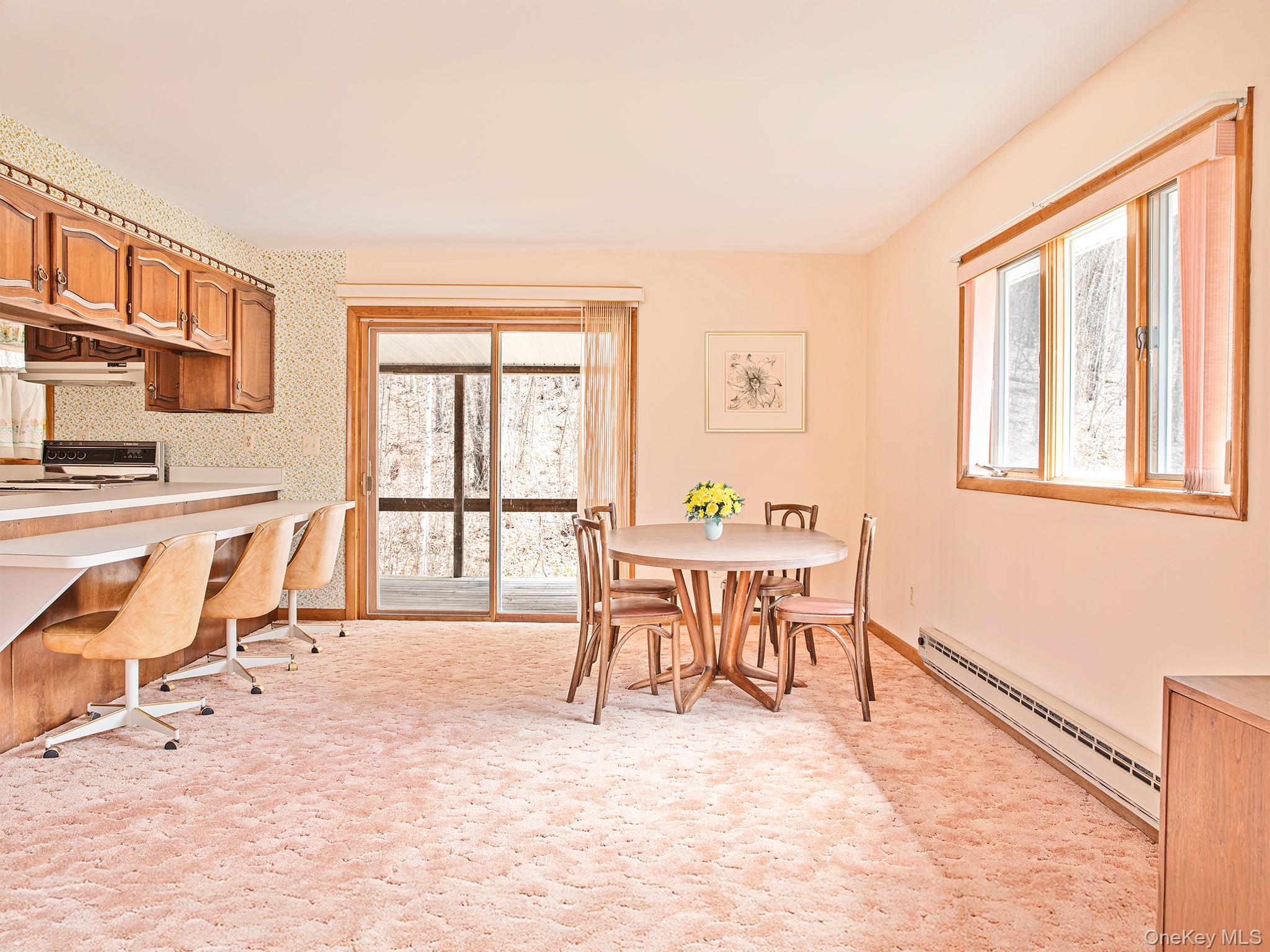 2182 Old Rte 17 Roscoe, NY 12776 - Photo 23 of 37 a dining room with furniture and a floor to ceiling window
