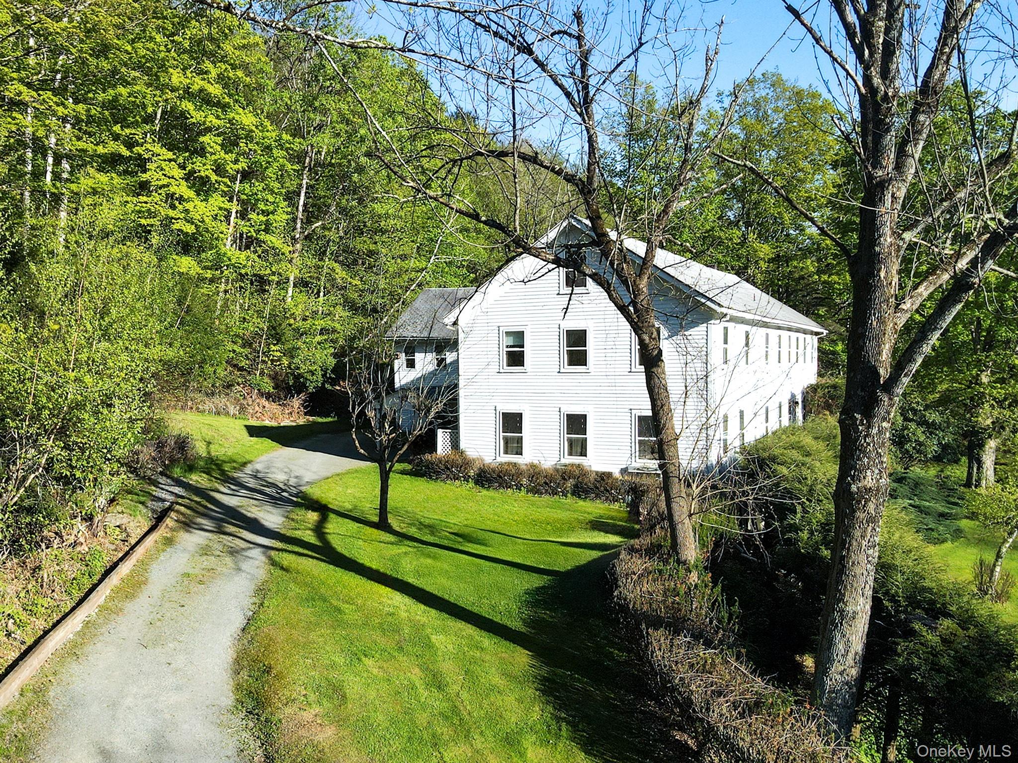 2182 Old Rte 17 Roscoe, NY 12776 - Photo 5 of 37 a front view of a house with a yard