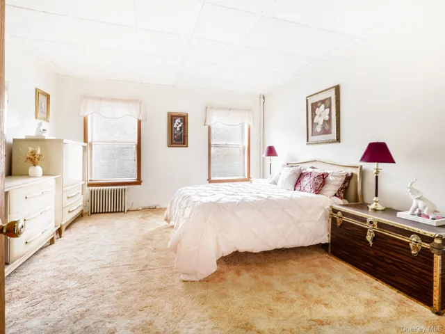 a kitchen with a refrigerator a table and chairs