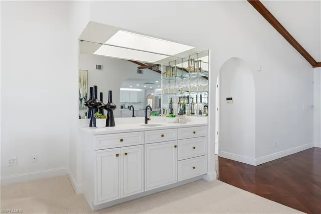 a spacious bathroom with a double vanity sink and a mirror
