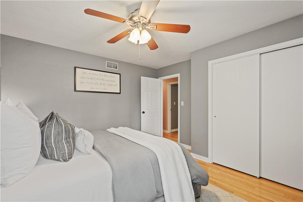 115 Maruth Drive Pittsburgh, PA 15237 - Photo 13 of 30 a bedroom with a bed and a chandelier