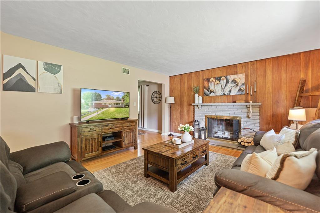 115 Maruth Drive Pittsburgh, PA 15237 - Photo 5 of 30 a living room with furniture a fireplace and a flat screen tv