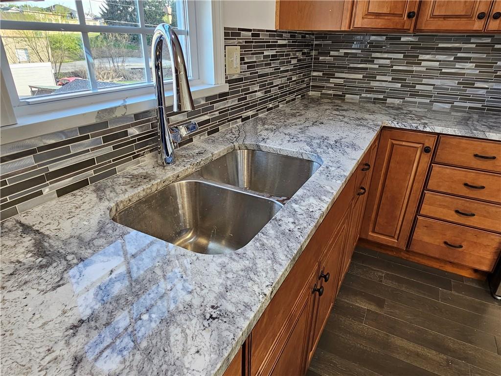536 Virginia Avenue Rochester, PA 15074 - Photo 11 of 24 a view of a kitchen sink and a wooden floor