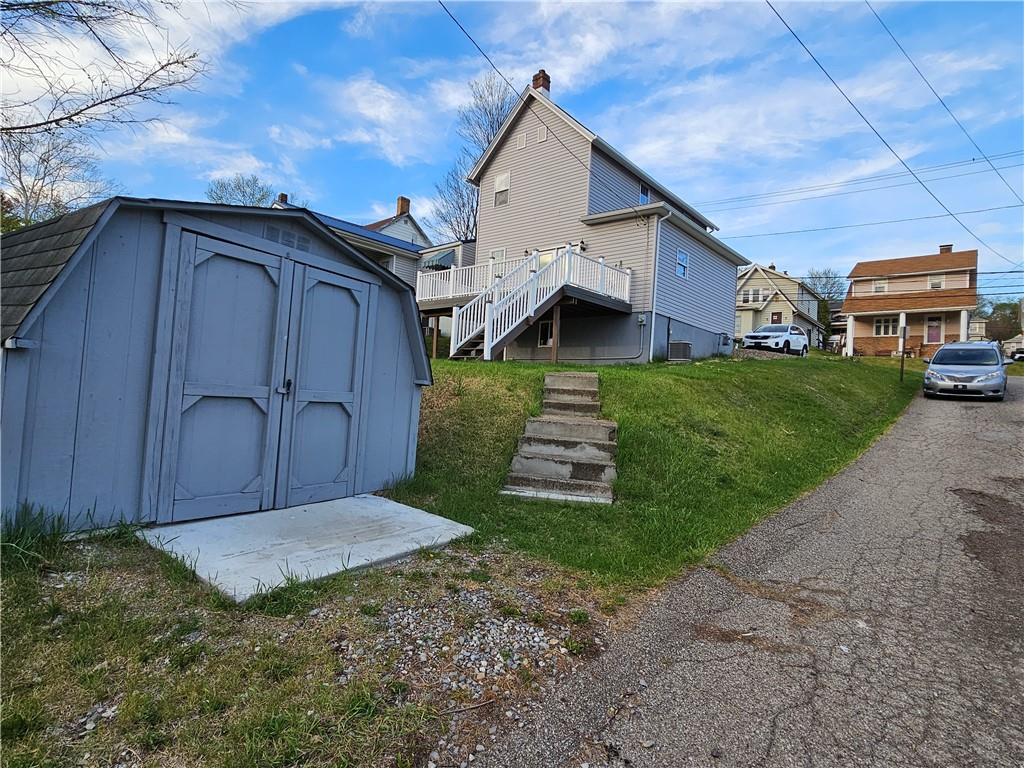 536 Virginia Avenue Rochester, PA 15074 - Photo 22 of 24 a view of a house with a yard plants and wooden fence