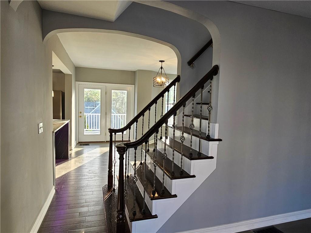 536 Virginia Avenue Rochester, PA 15074 - Photo 6 of 24 a view of entryway with wooden floor and stairs