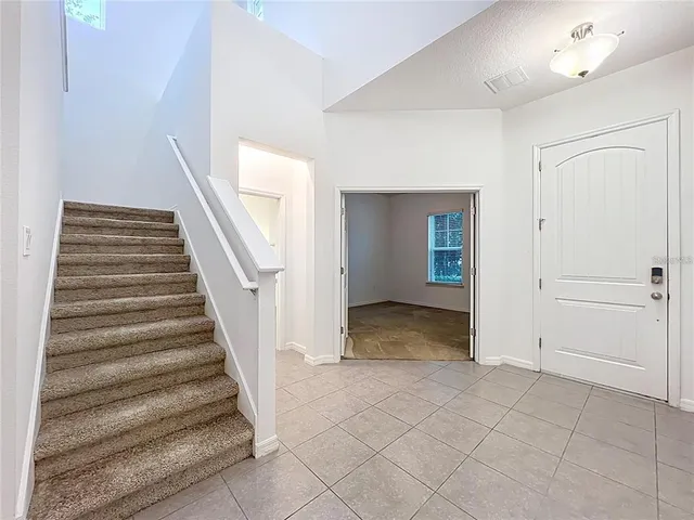 a view of an empty room with a window