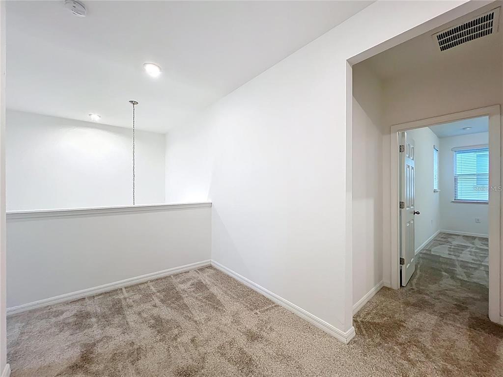 12821 Westside Vlg Loop Windermere, FL 34786 - Photo 24 of 42 an empty room with closet