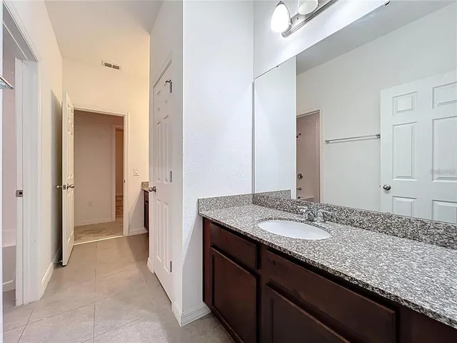 a view of a big room with windows and closet