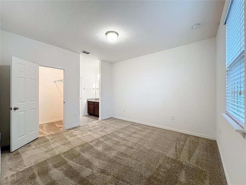 12821 Westside Vlg Loop Windermere, FL 34786 - Photo 32 of 42 a view of a big room with windows and closet